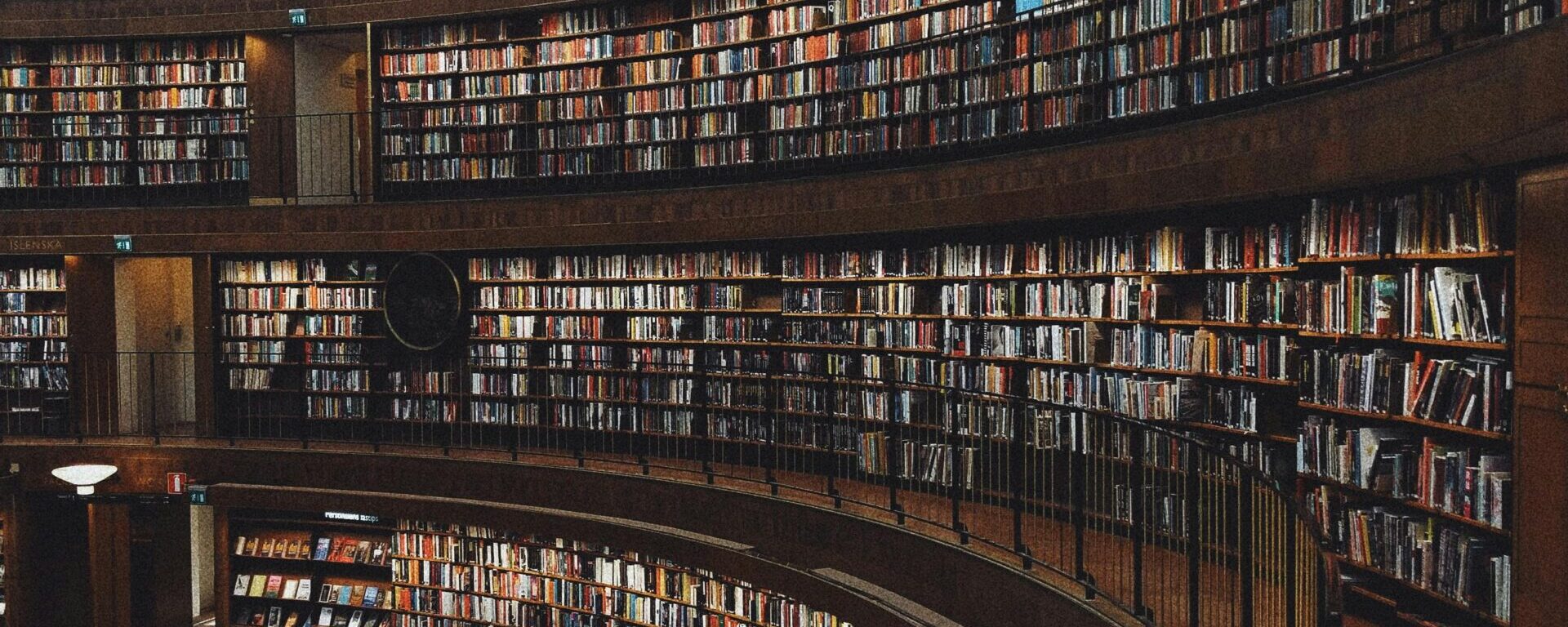 Explore a stunning circular library with endless bookshelves, offering a haven of knowledge and tranquility.